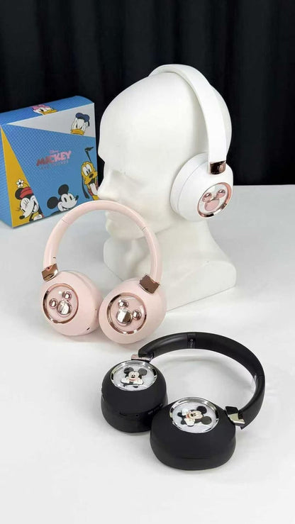 Set of headphones with Mickey Mouse design on a white surface with a black background