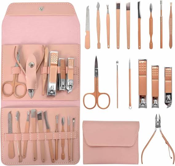 open kit manicure set with tools on a white surface